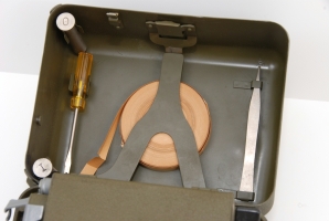 The tools of the M-209 stored in the top lid