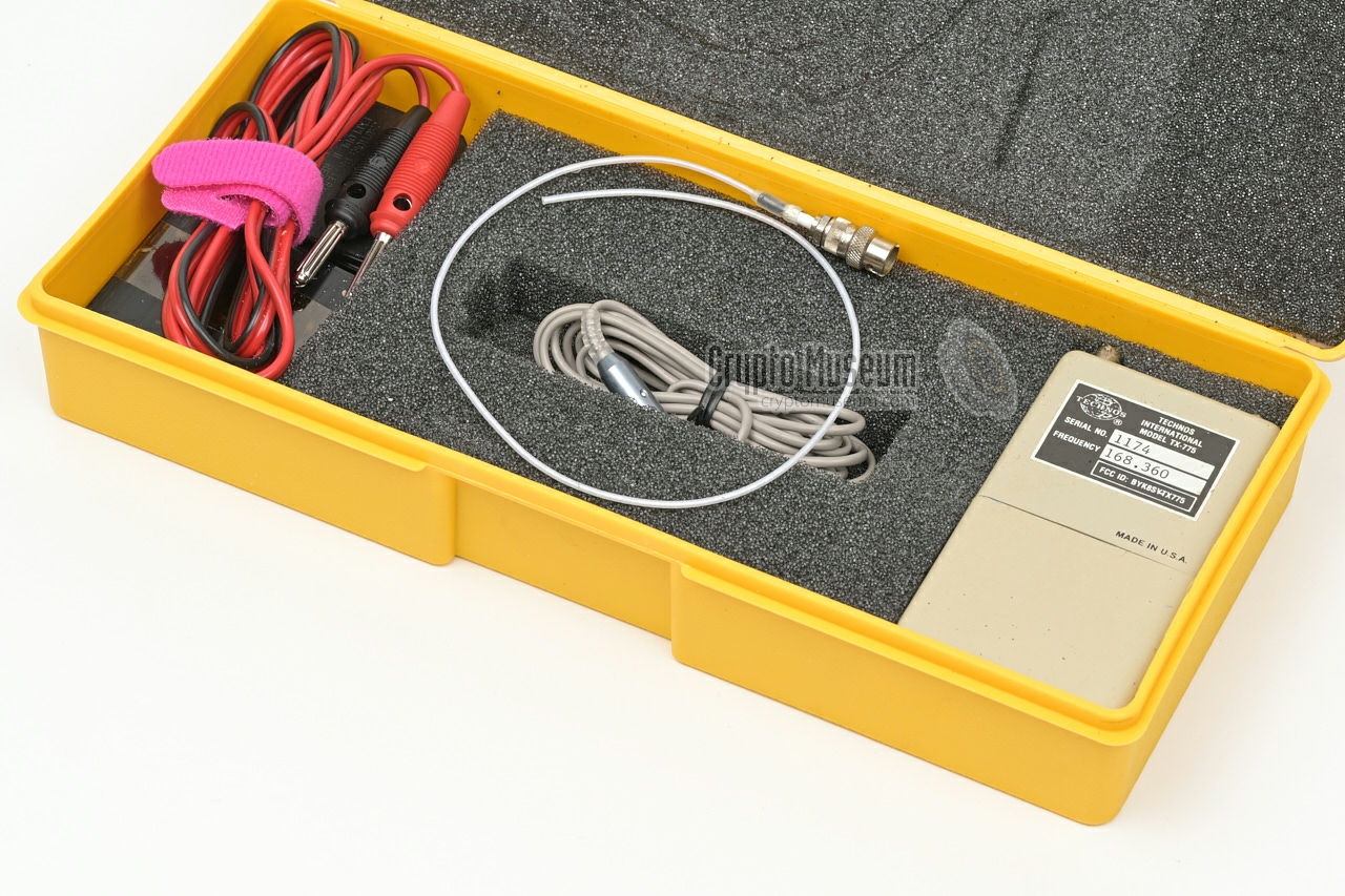TTX-775 with antenna, microphone and batteries in yellow plastic storage case