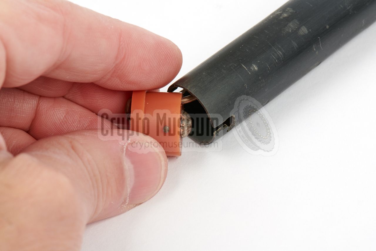 Removable tip at the end, giving access to the battery compartment.