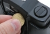 Opening the battery compartment with a coin