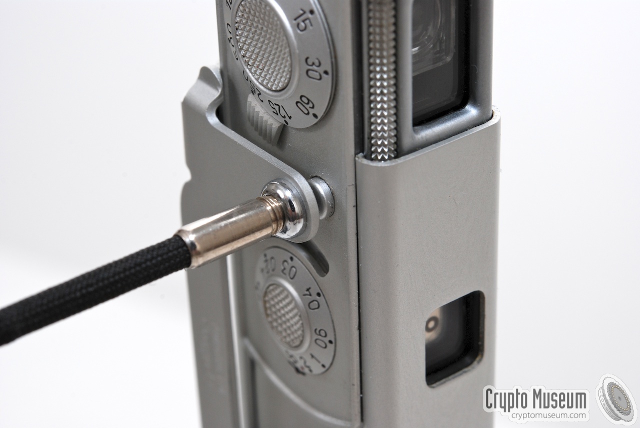 The shutter release cable mounted to the bracket, allowing the shutter button to be engaged remotely.