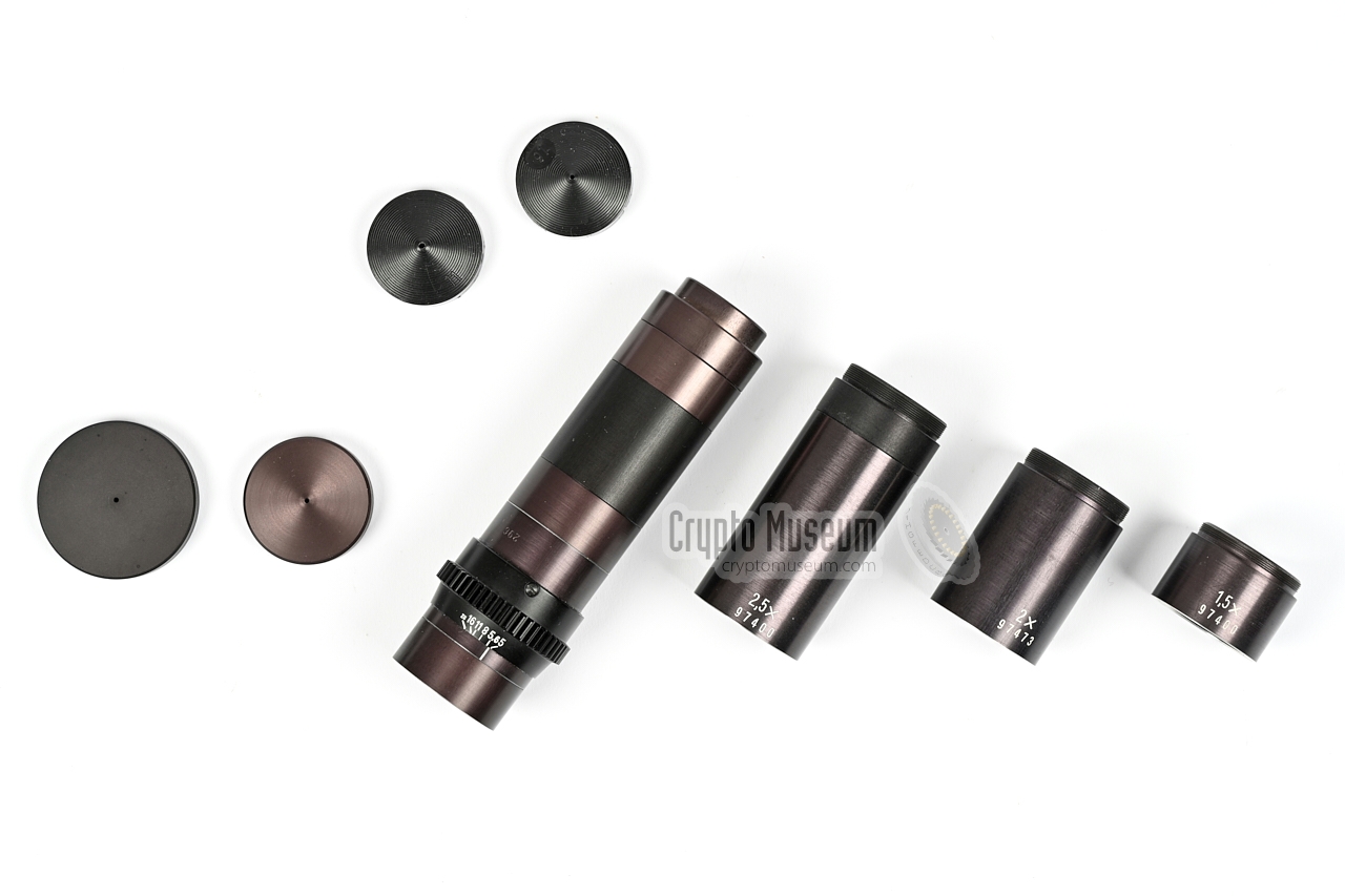 Lens, range extenders and pinhole lens caps