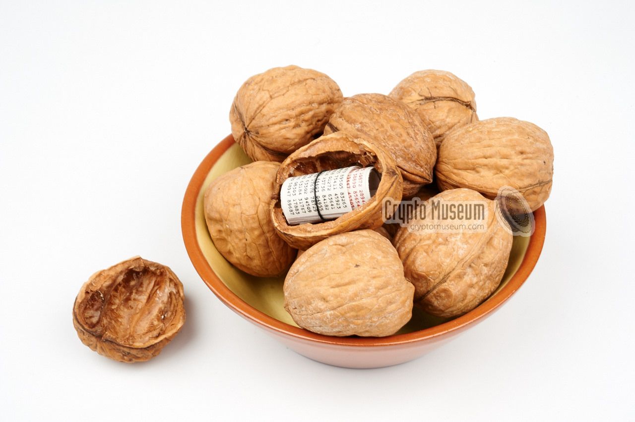 OTP booklets hidden inside a real walnut