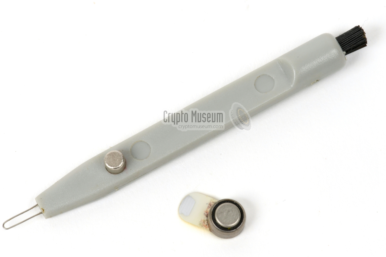 Cleaning aid with metal tip, brush and magnetic stub