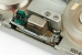 Spring-loaded bar and spring-loaded cleaning pad interlocked, to allow easy loading of the wire.