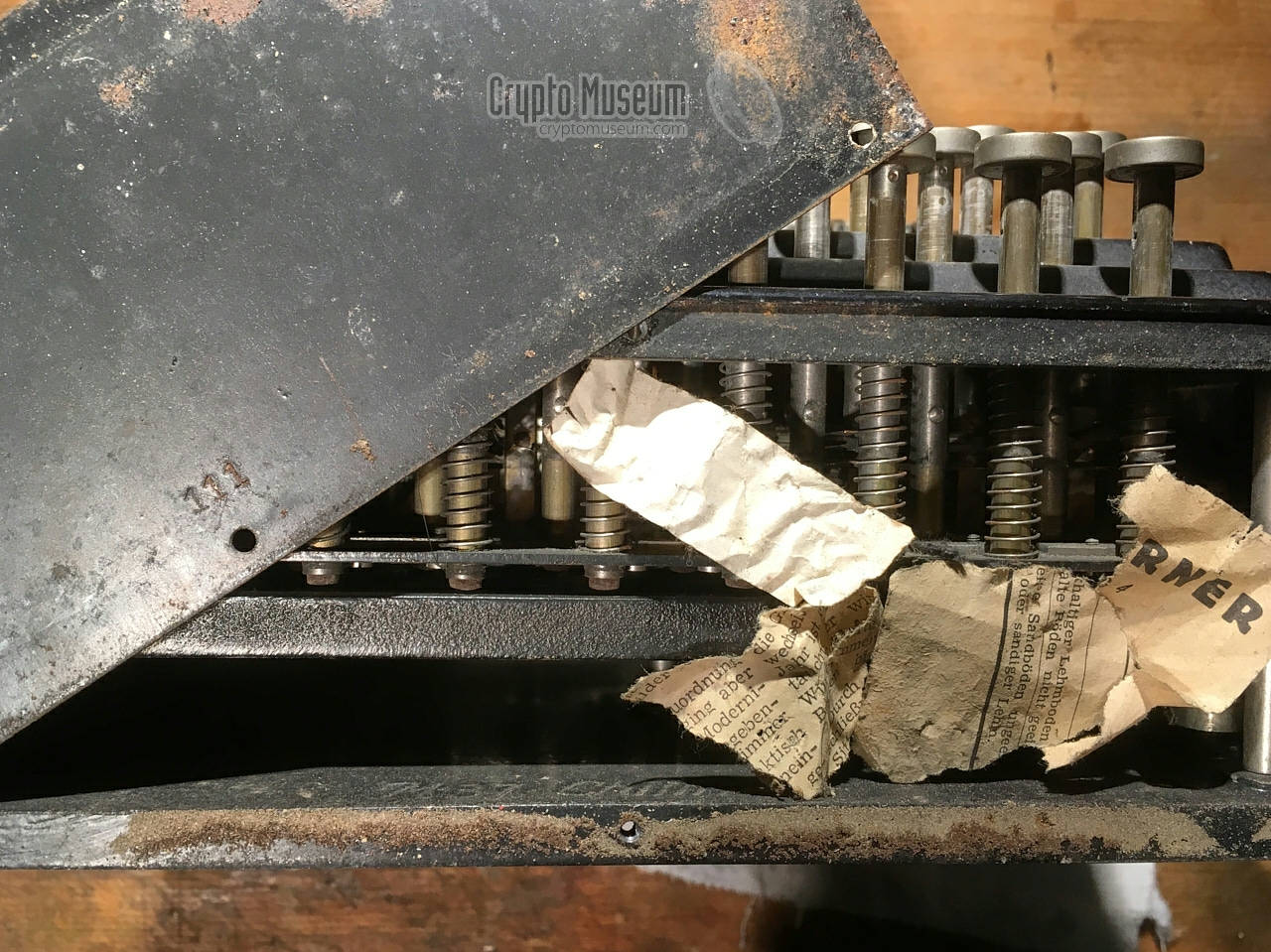 Debris inside the machine. Note the serial number at the front panel.