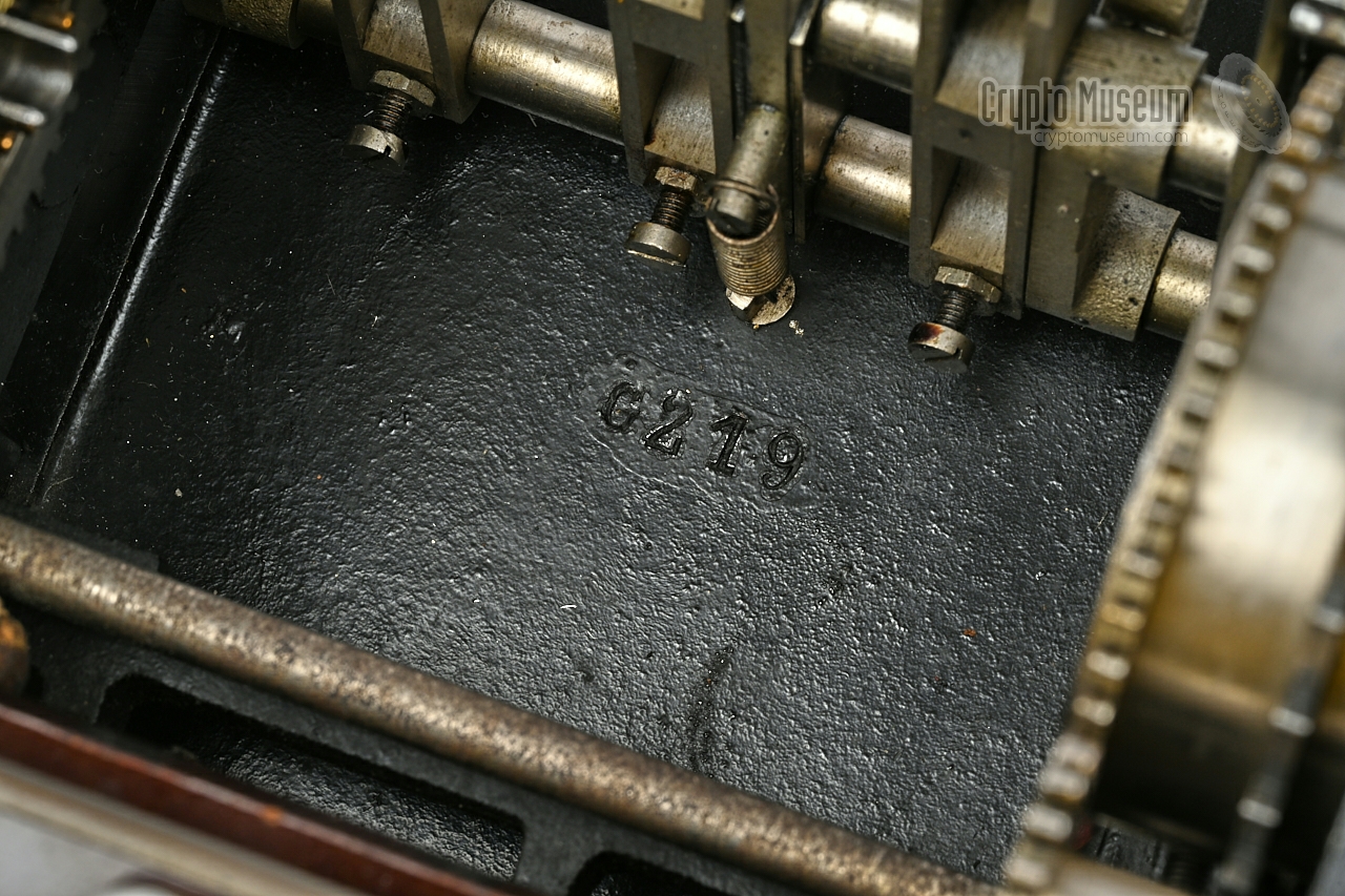 Serial number engraved in the bottom panel, below the rotor stack.