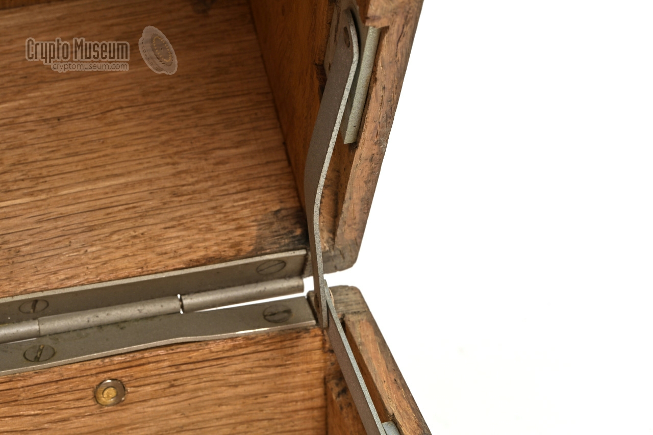 Rightmost lid retaining bracket bended