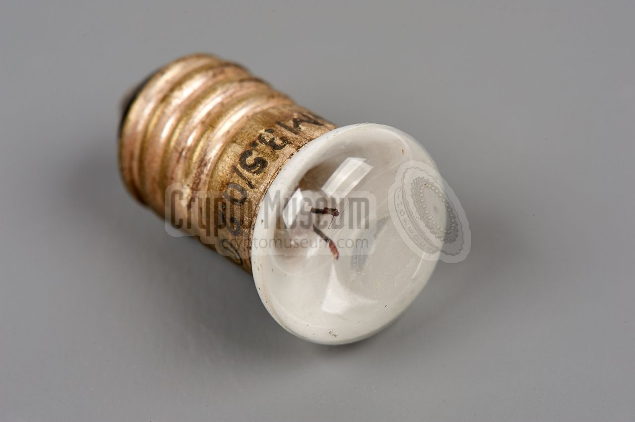 Flattened half-opaque light bulb, with filament clearly visible