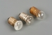 Three light bulbs with E10 fitting. The two on the left are flattened.