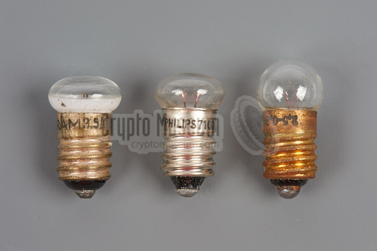 Three light bulbs with E10 fitting. The two on the left are flattened.