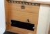 The top lid of the wooden box which is also the storage place for the spare light bulbs, the paper clip and the green lamp filter.