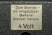 Metal placard with voltage