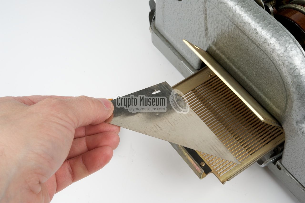 Placing the metal test triangle in the card reader