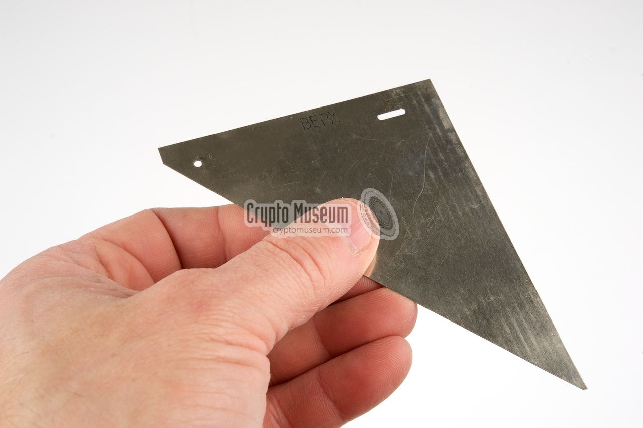 Holding the metal test triangle