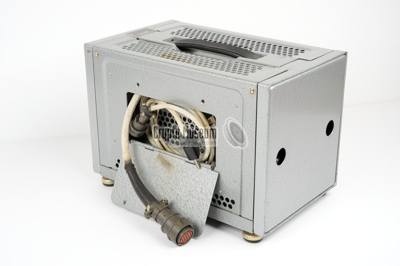 The cables stored in a compartment at the right side