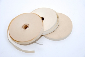 Three paper rolls for the Hagelin C-446. The frontmost one is pre-gummed (read the warning).