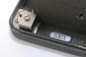 Serial number engraved in the bottom plate at the front of the machine.