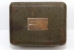 The serial number plate mounted on top of the cover of the M-209-A