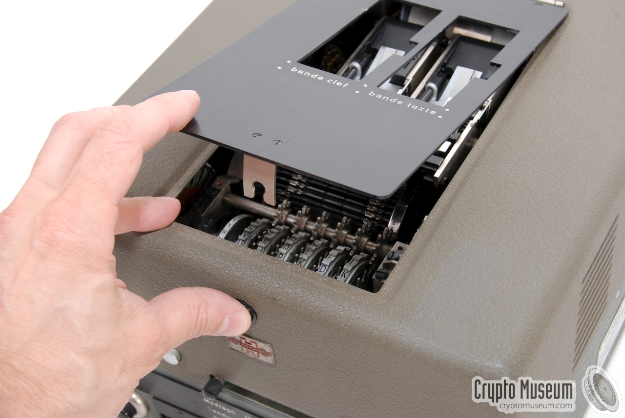 Opening the lid over the paper readers