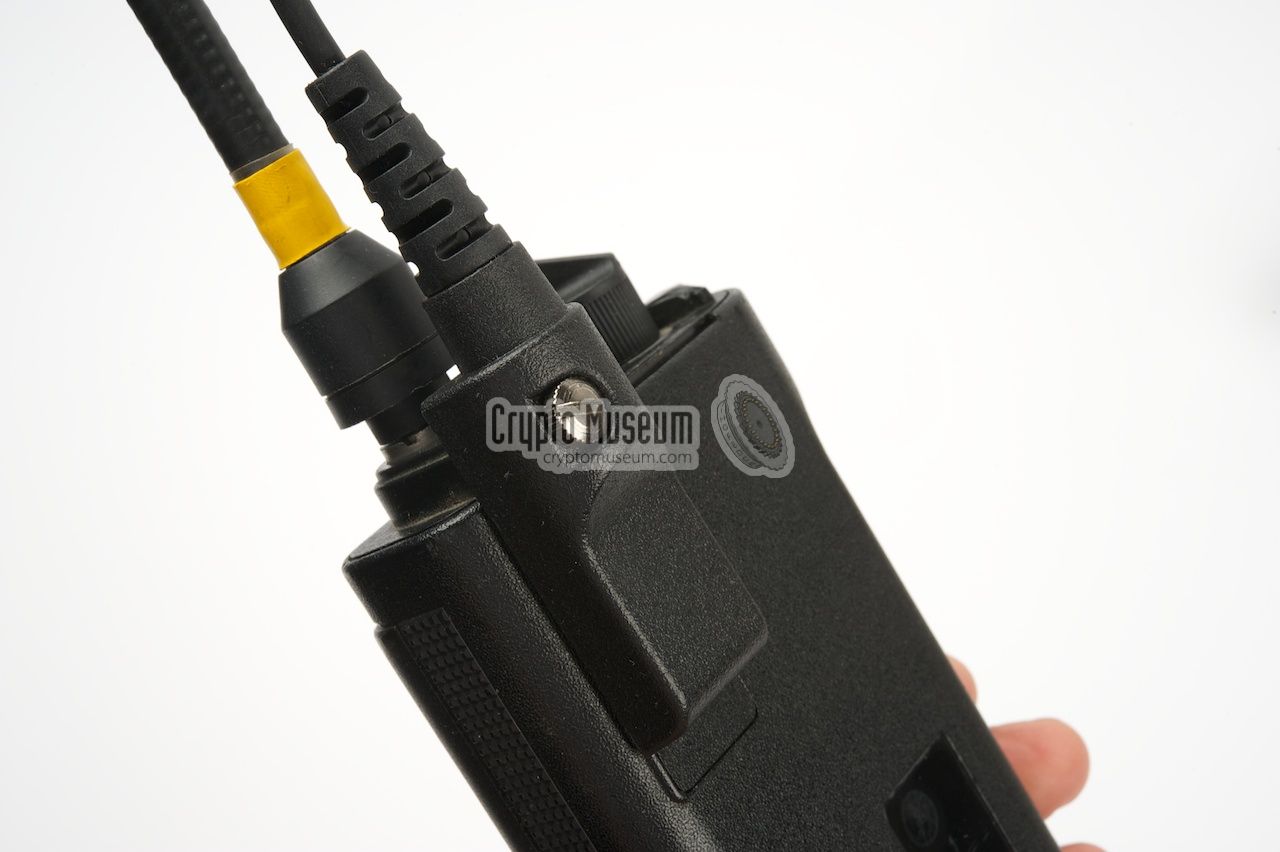 Programming cable mounted to the radio