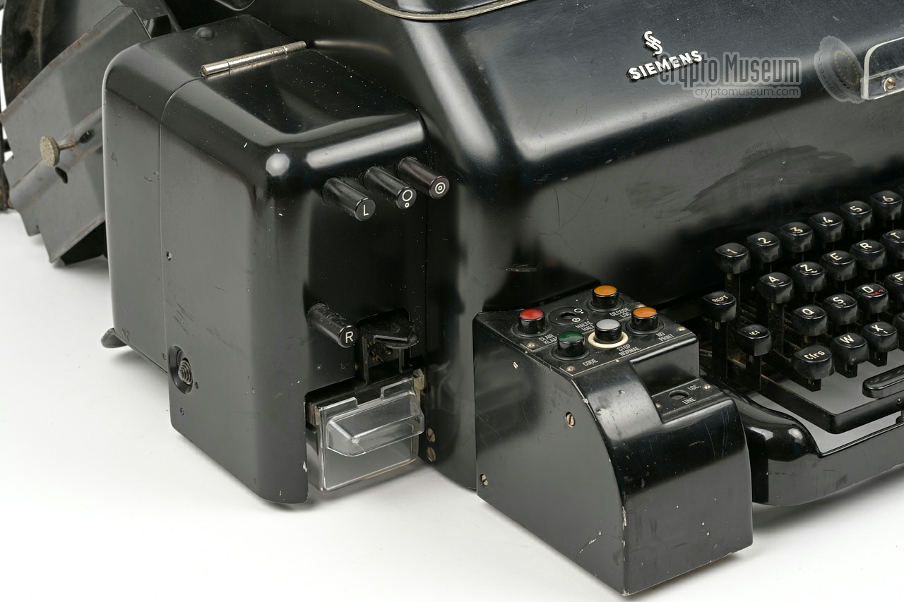 Tape puncher (perforator) at the left