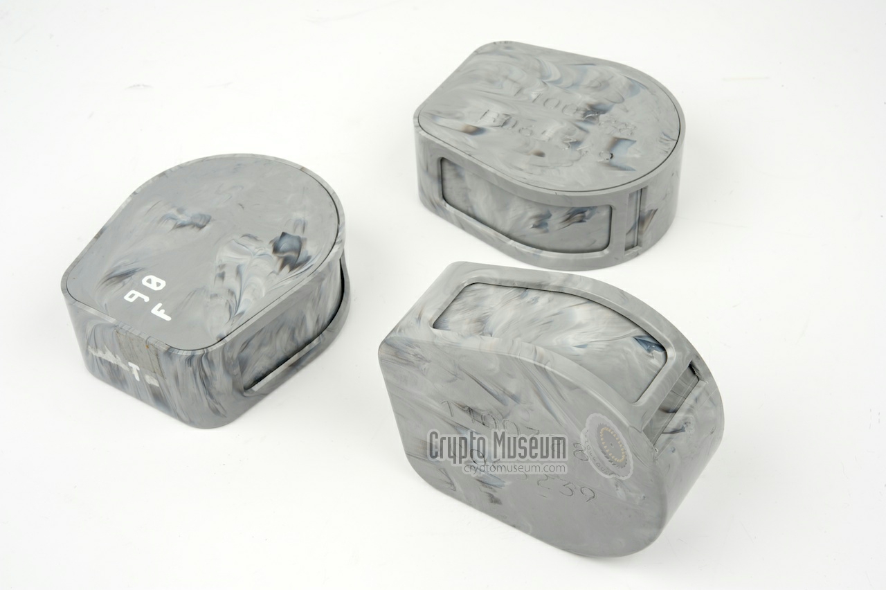 Three empty key tape canisters