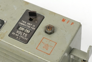 Voltage selector and (red) stamps on the top panel