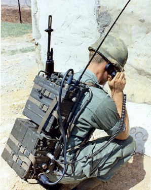 US soldier in Vietnam operating a PRC-77 radio with KY-38 voice encryptor. 16 October 1969 [2].