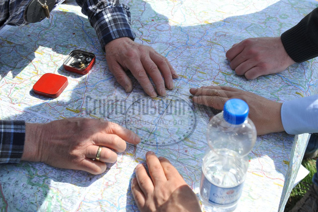 Gathered around the map in order to establish the possible location