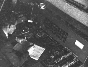 Operator behind the statistical analysis machine, seen from the right