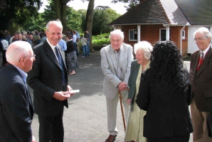 Keith and Mavis Batey (centre) talking to Dr. David Hamer and Sir Francis Richard at the Enigma Reunion in 2009. Copyright David Hamer.