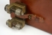 Close-up of the leather strap and buckle that are used to keep the antenna plug in place