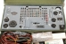 Frontal view of the transceiver. In the front some of the accessories.