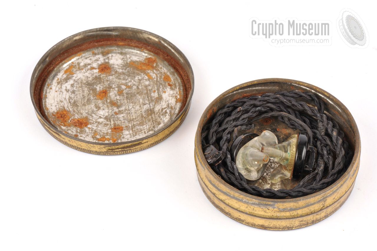 Earphones stored inside tobacco tin