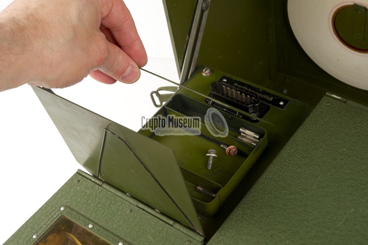 Spare parts compartment just behind the printer